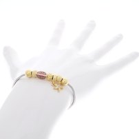 Dámsky strieborný náramok v zlatej farbe s guličkami,